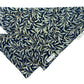 black bandana with leaf pattern on a white background