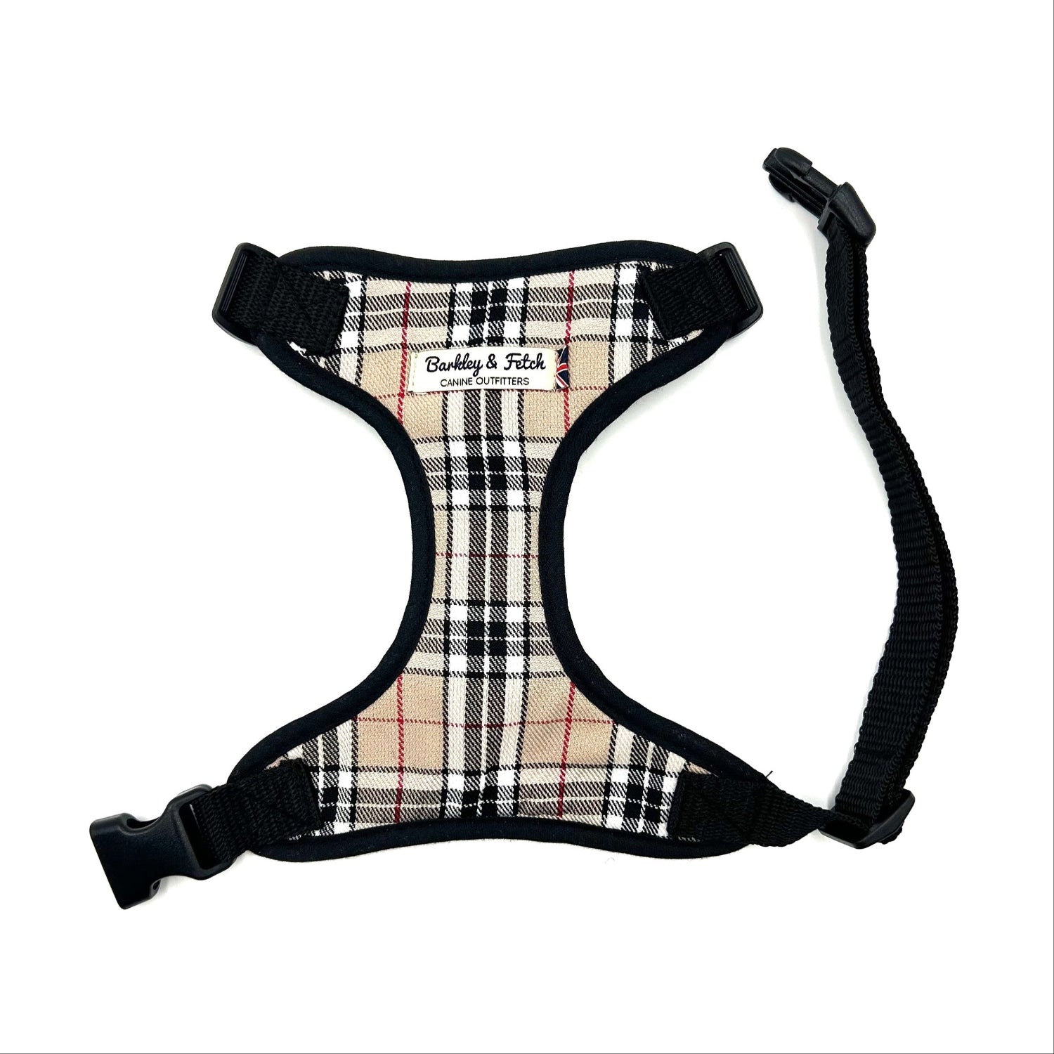 Plaid dog harness with black straps on a white background