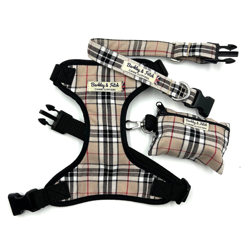 Plaid dog harness, leash, and pouch set on a white background
