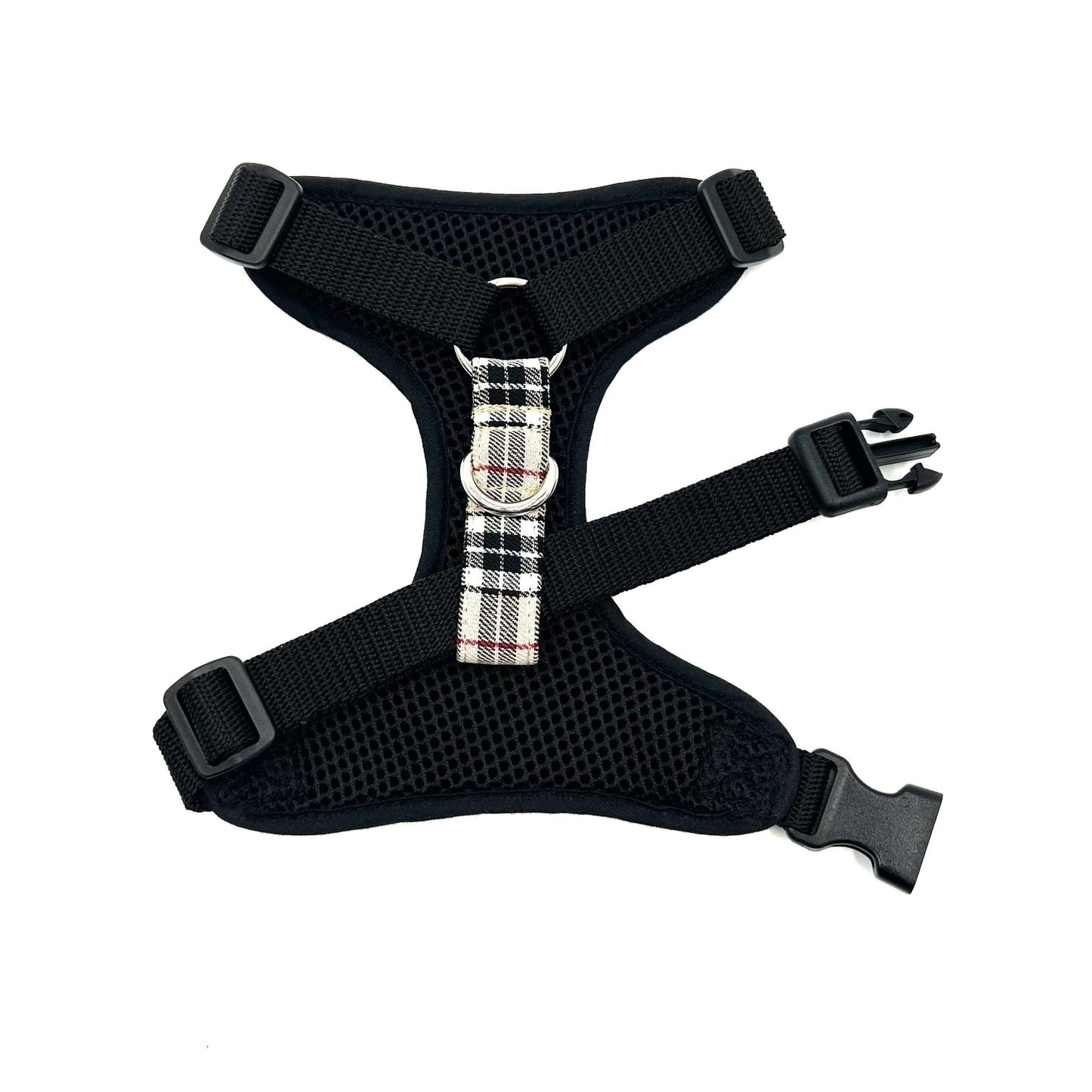 Black dog harness with plaid buckle on a white background