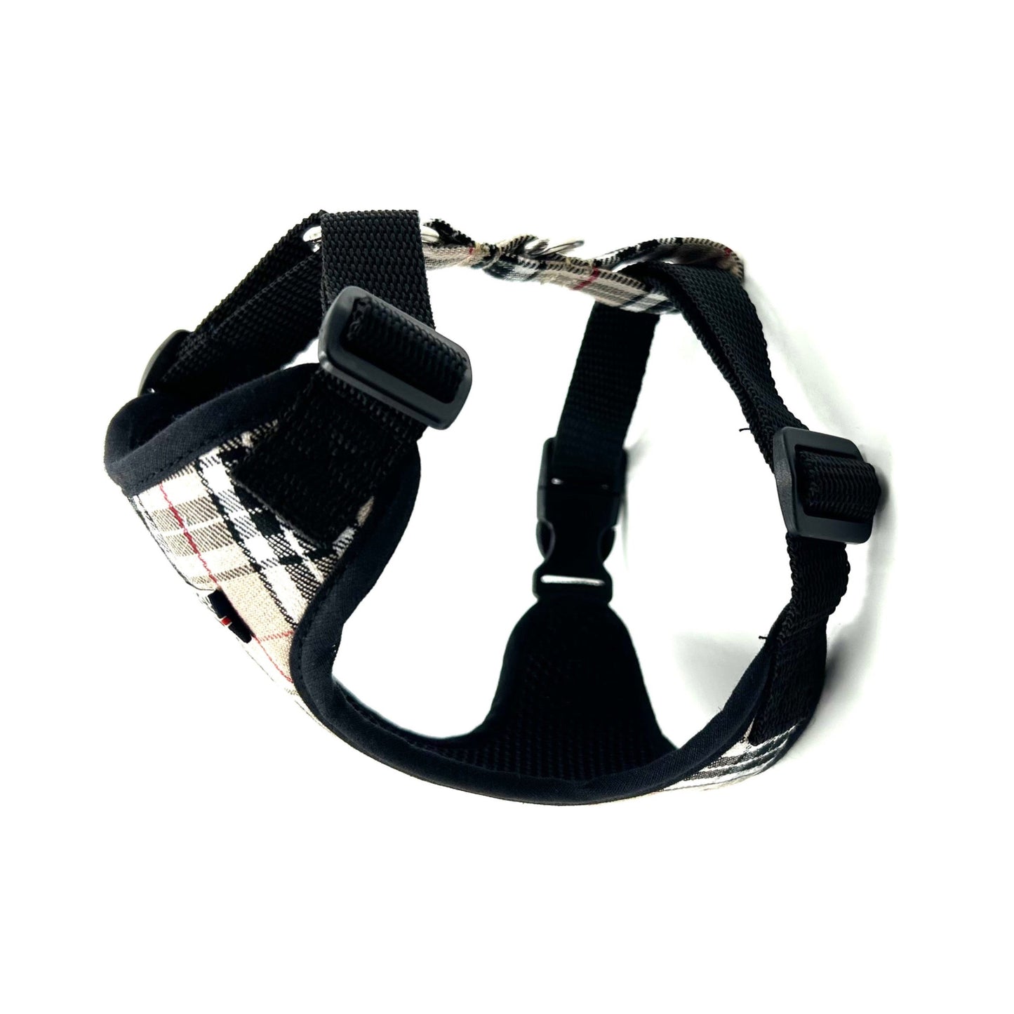 Black dog harness with plaid pattern on a white background