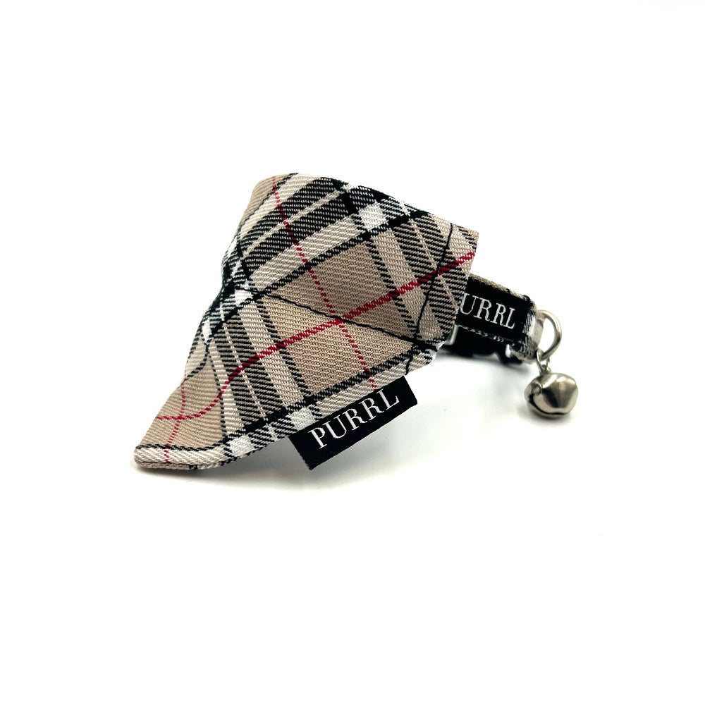 Plaid patterned cat accessory with 'PURRL' branding on a white background