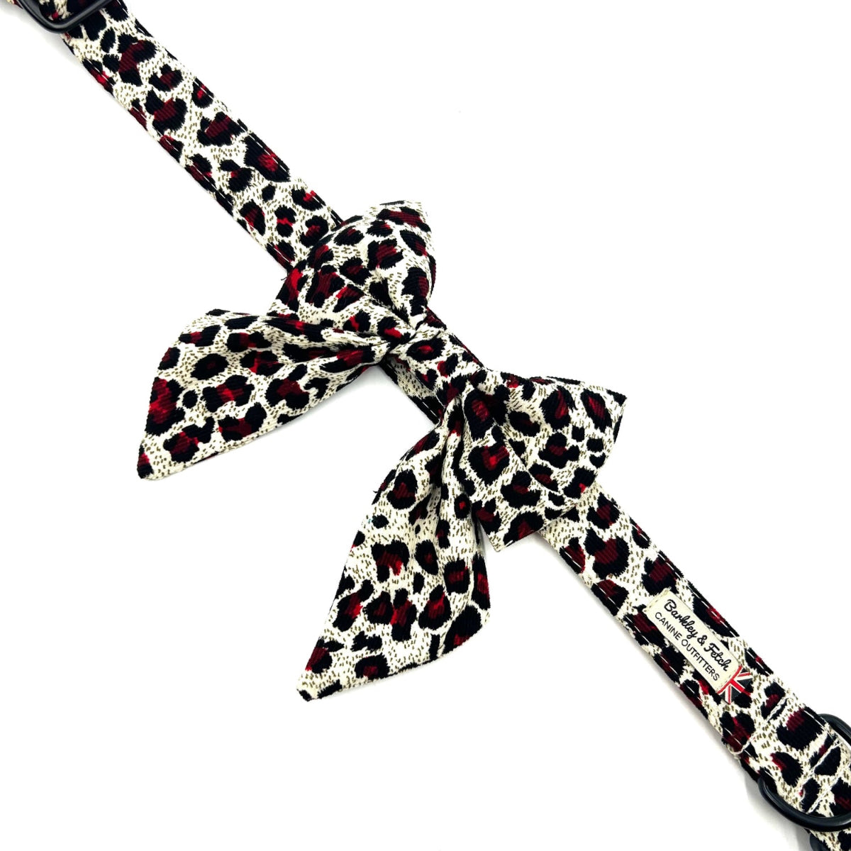 Leopard print dog leash with a bow on a white background