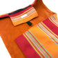 Orange and red fabric with striped pattern on a white background, dog settle mat handmade by Barkley and fetch UK
