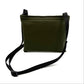 Khaki colour settle mat folded into a velcro closed bag with a black shoulder strap handmade by Barkley and fetch in the UK, against a white background