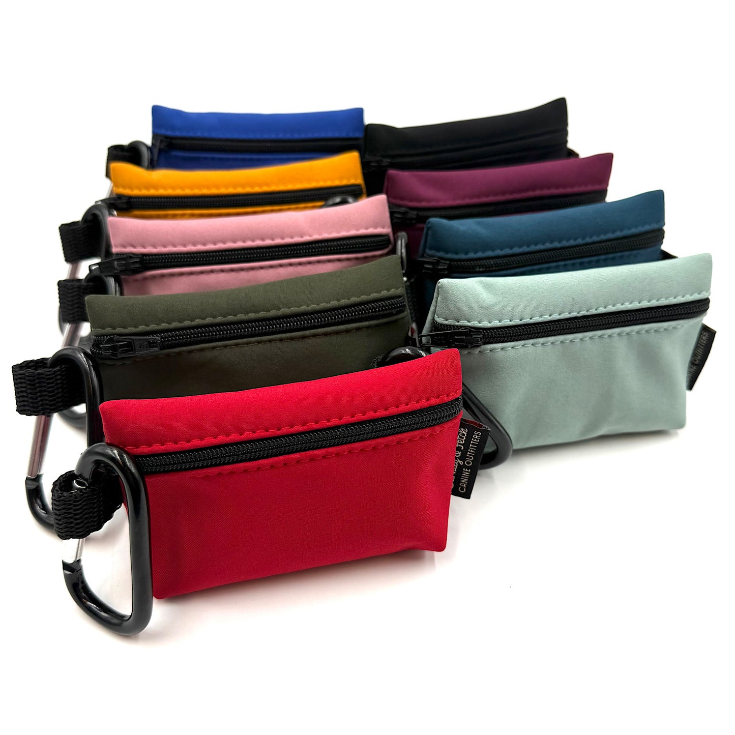 Assorted colourful small pouches with zippers on a white background handmade by Barkley and fetch UK