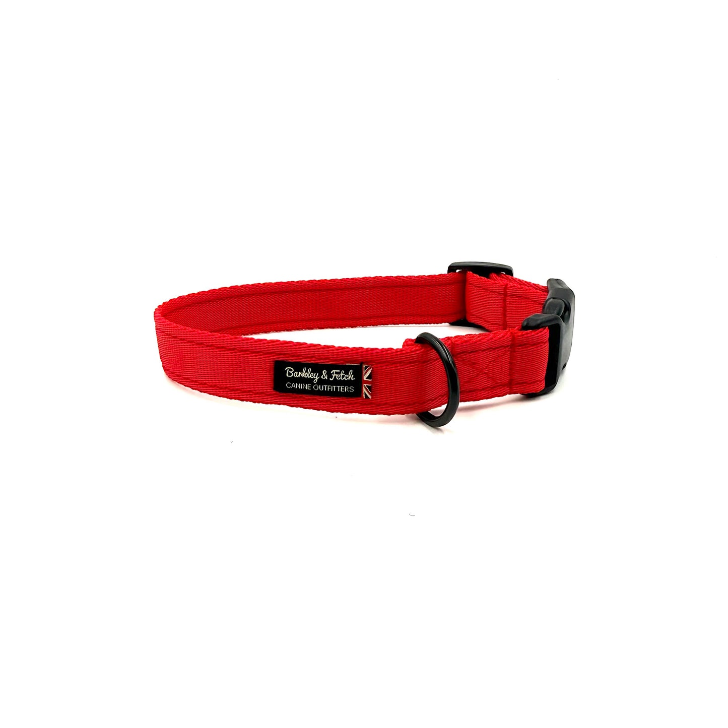 Red dog collar with a black buckle on a white background