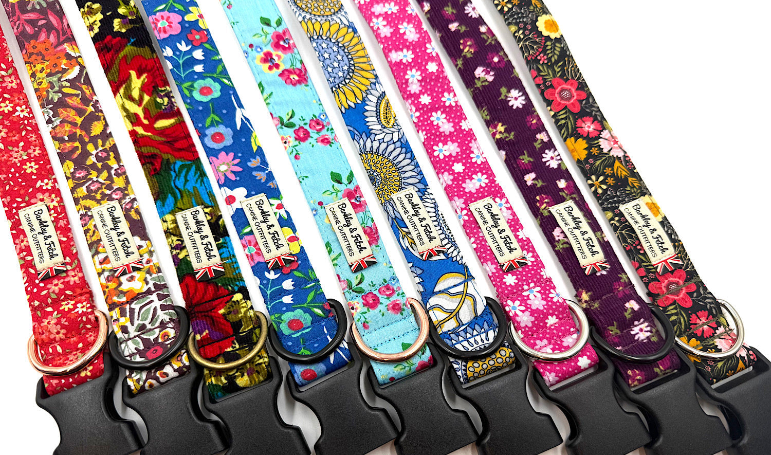 Set of colorful dog collars with floral patterns on a white background