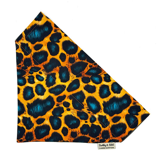 Dog bandana with a leopard print pattern on a white background. Handmade in UK by Barkley and Fetch