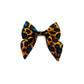 Leopard print bow tie on a white background. Handmade by Barkley and Fetch UK