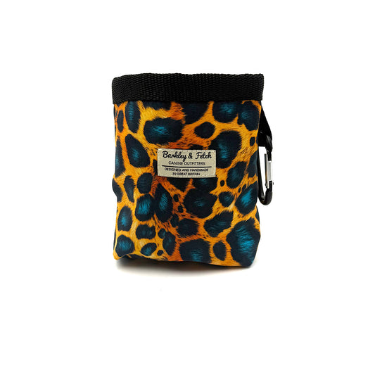Leopard print dog treat pouch with black strap and carabiner on a white background. Handmade by Barkley and Fetch UK