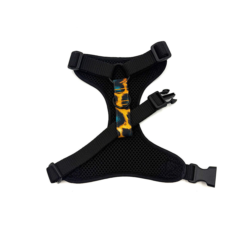 Black dog harness with colourful pattern on a white background. Handmade in UK by Barkley and Fetch