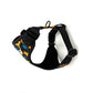Black dog harness with colorful pattern on a white background. Handmade in UK by Barkley and Fetch