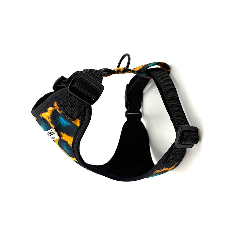 Black dog harness with colorful pattern on a white background. Handmade in UK by Barkley and Fetch