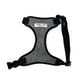 A grey herringbone pattern dog harness with adjustable straps and a heavy-duty d-ring, displayed on a white background.