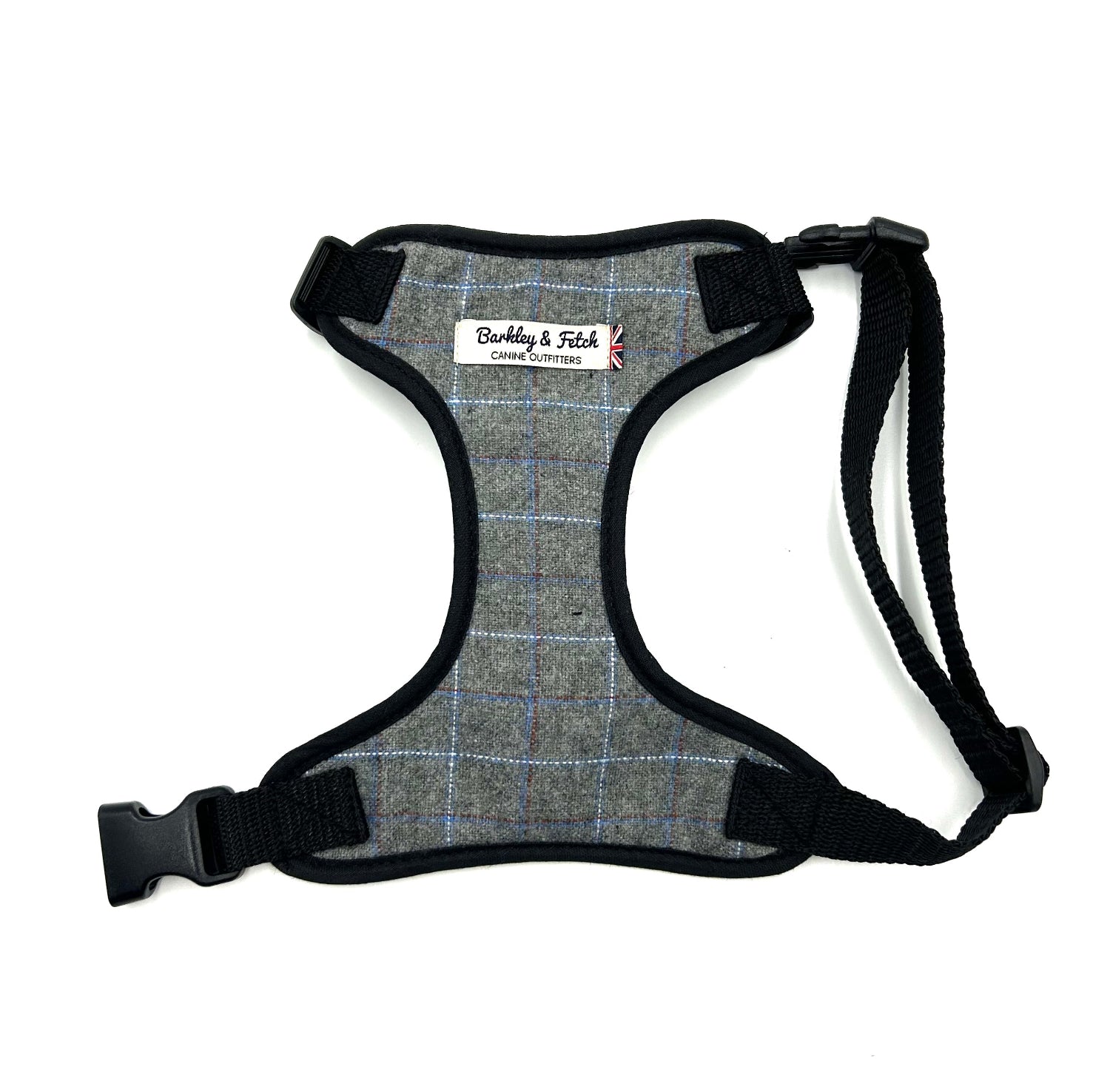 Gray plaid dog harness with black straps on a white background