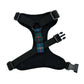 Black dog harness with tartan strap on a white background