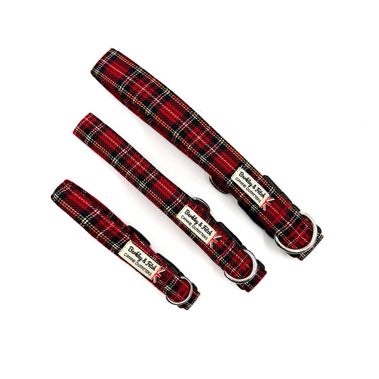 Three handmade red tartan dog collars diagonally placed on a white background