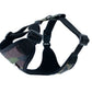 Black dog harness with camouflage padding on a white background