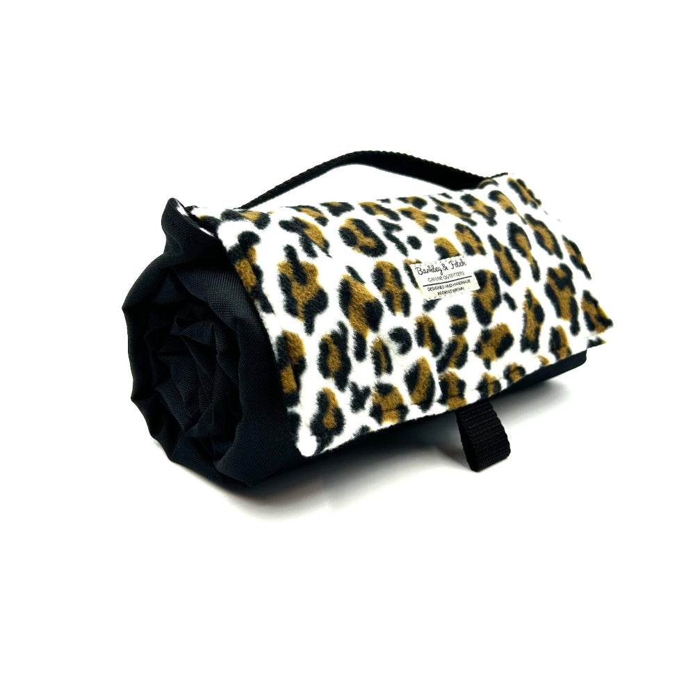 Roll-up blanket with leopard print design on a white background British handmade by Barkley and Fetch