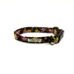 Floral patterned dog collar with a visible brand label on a white background