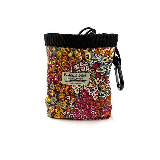 Floral patterned pouch with a carabiner on a white background