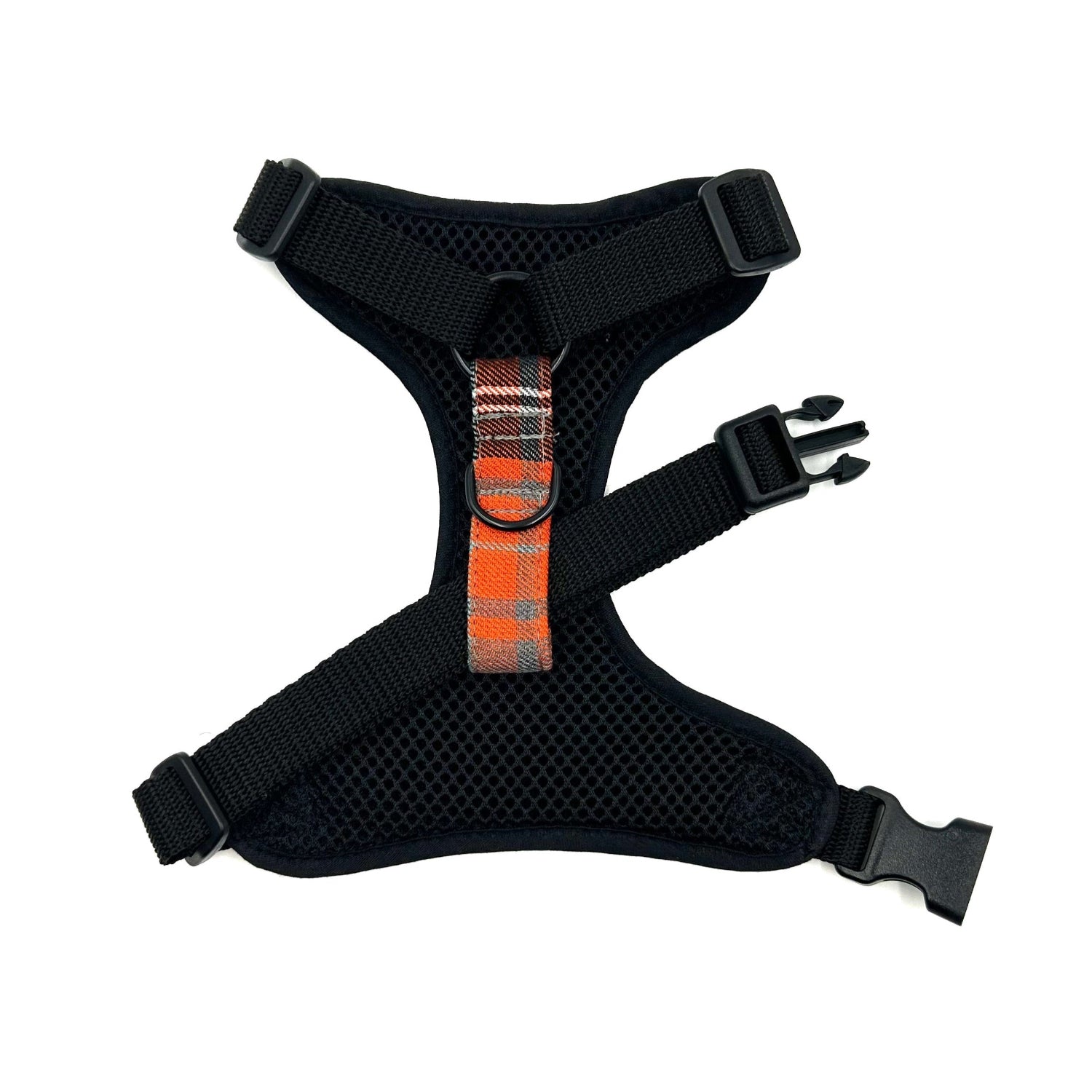 Black dog harness with orange reflective strip on a white background