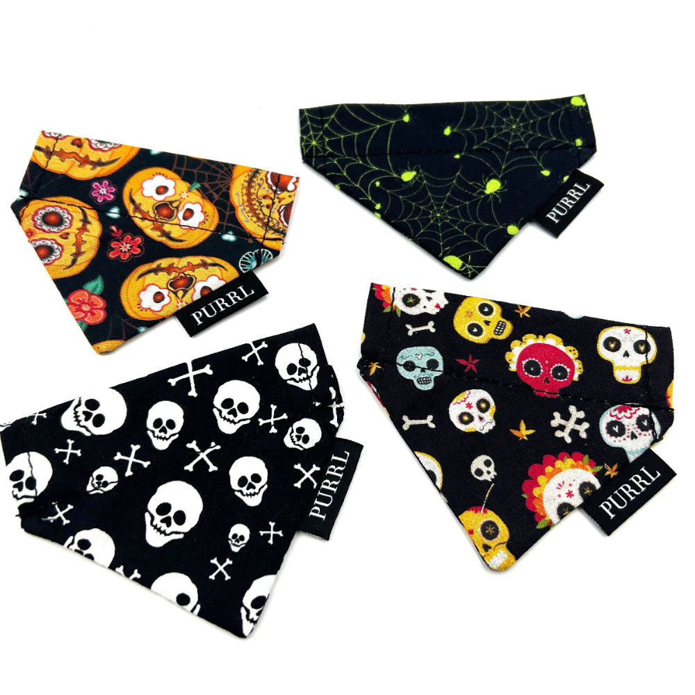 Four Halloween-themed pet bandanas with skull, pumpkin, and spider web designs on a white background handmade in the UK by Barkley And Fetch