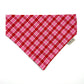 Pink and red checkered bandana with a brand tag on a white background