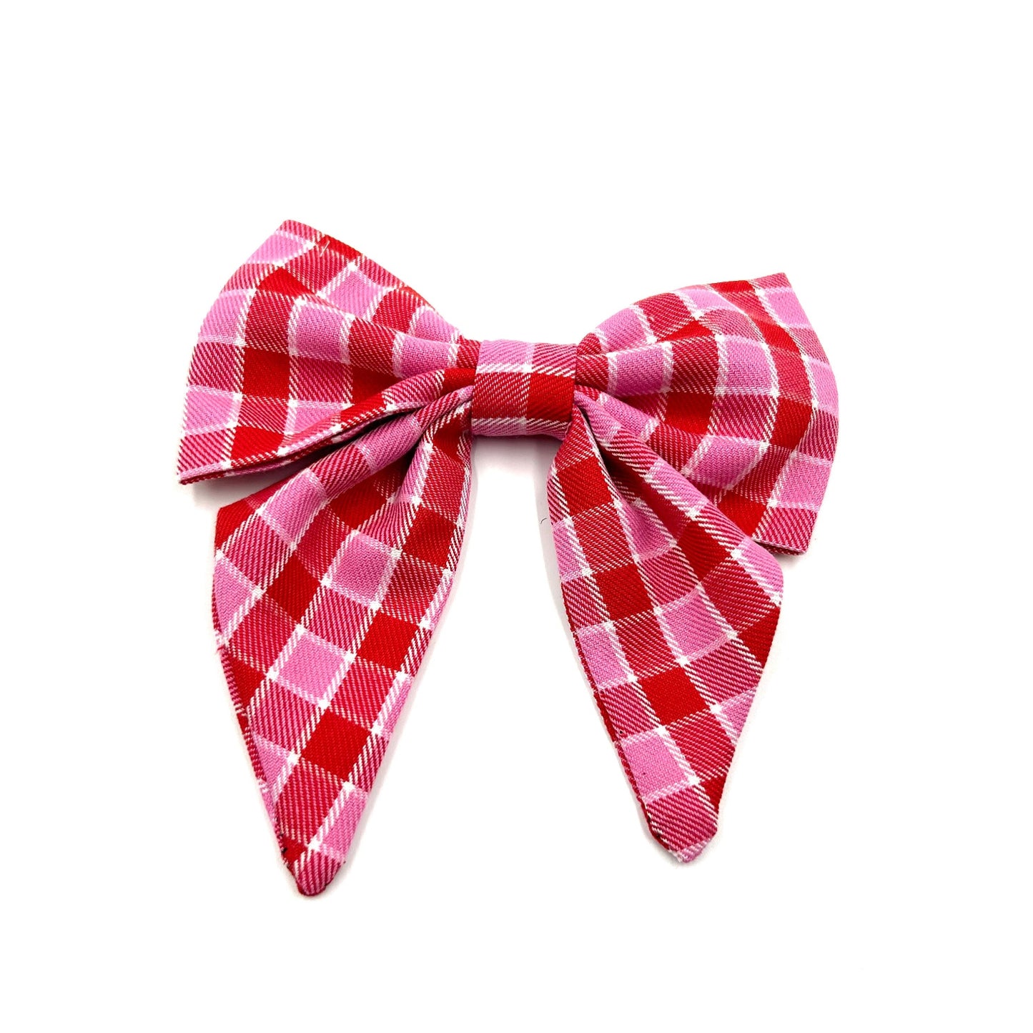 Handmade sailor bow in pink and red tartan fabric made to attach to a dog collar