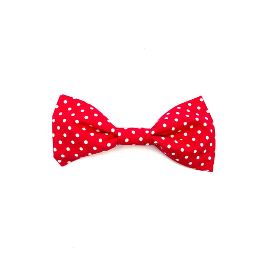 Handmade red bowtie with white spots with loops on the back to thread through a dog collar
