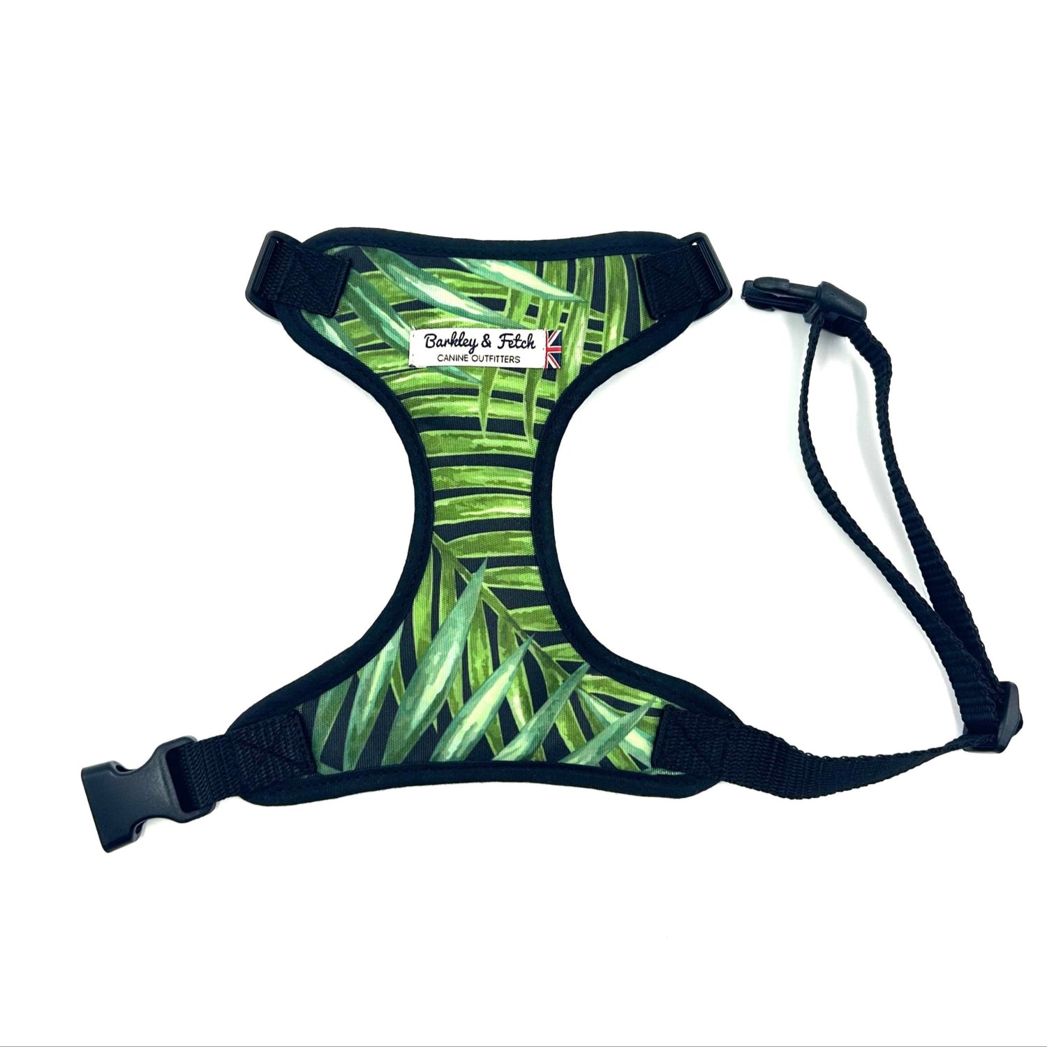 Dog harness with green leaf pattern on a white background