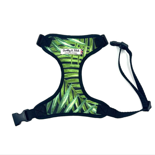 Dog harness with green leaf pattern on a white background