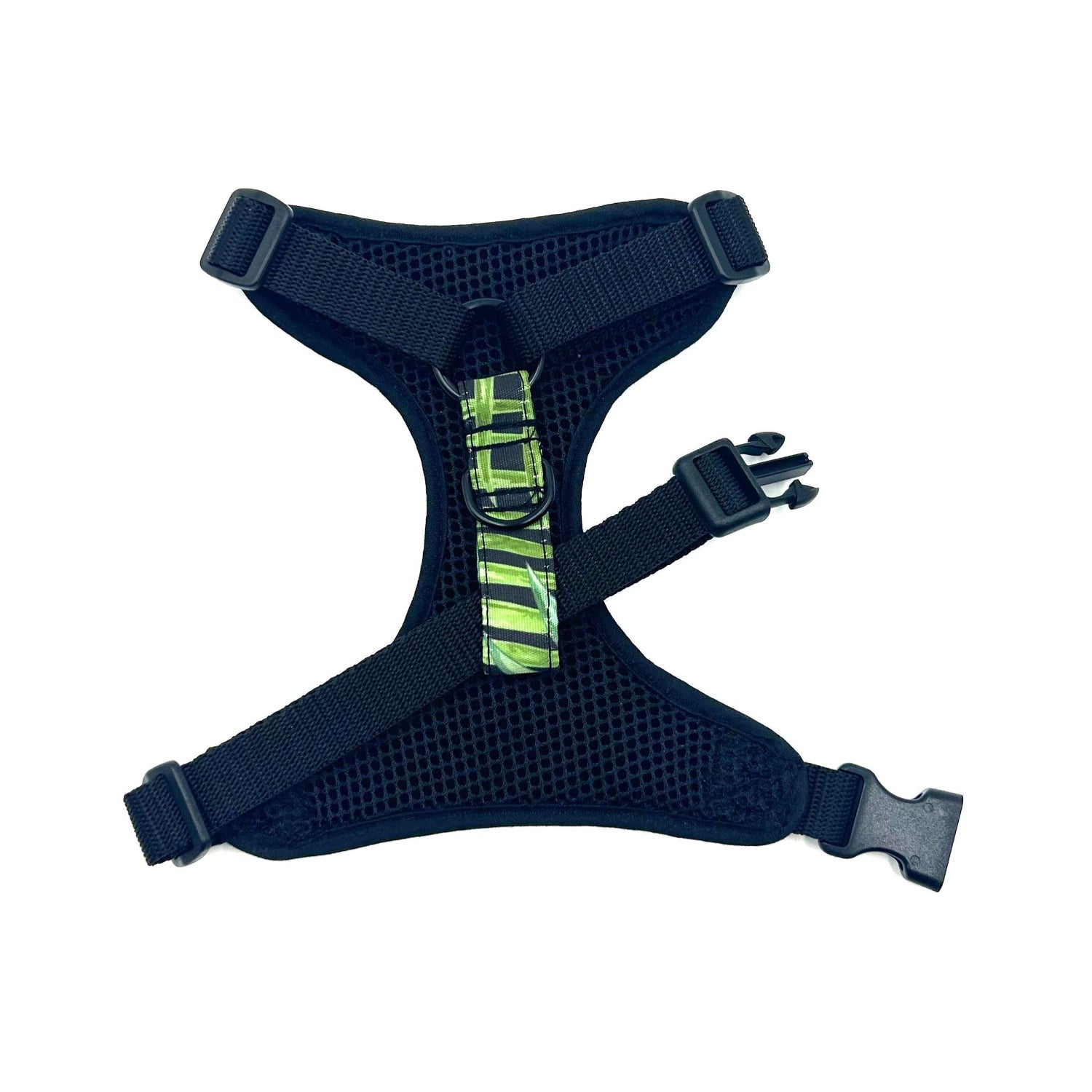 black dog harness with a green and black pattern on a white background