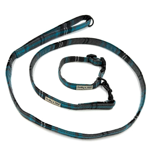Blue and black patterned dog leash with a matching collar on a white background