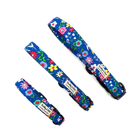 Set of floral-patterned dog collars and leashes on a white background