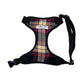 Plaid dog harness with black straps on a white background