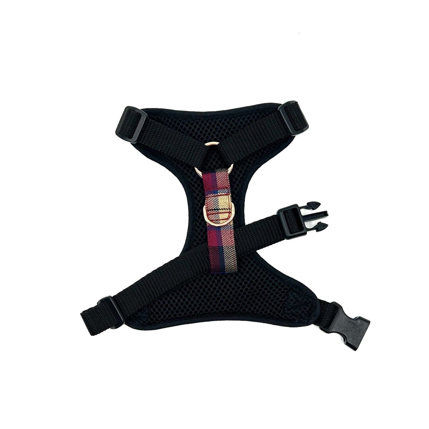 Black dog harness with a colorful plaid strap on a white background