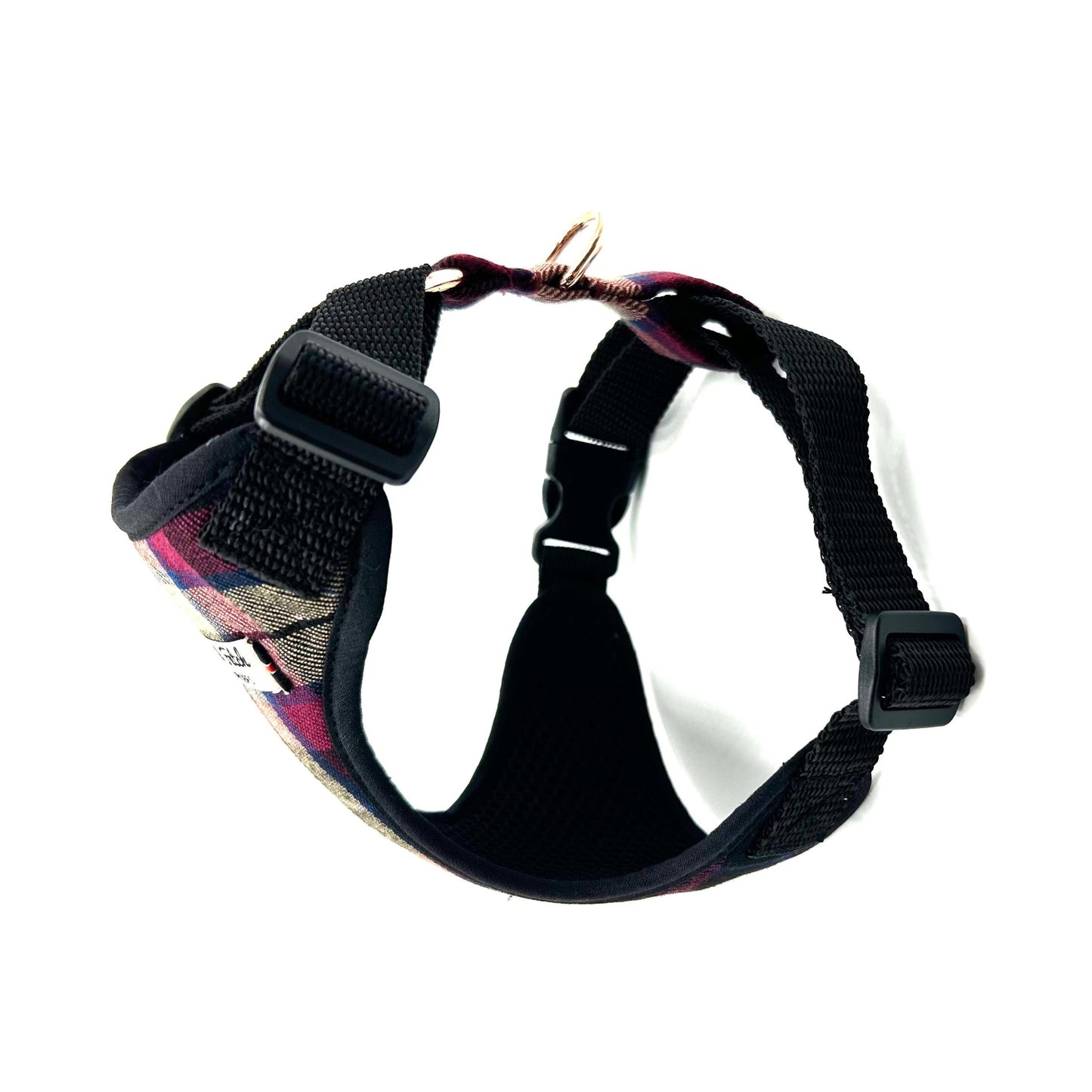 Black dog harness with colorful floral pattern on a white background
