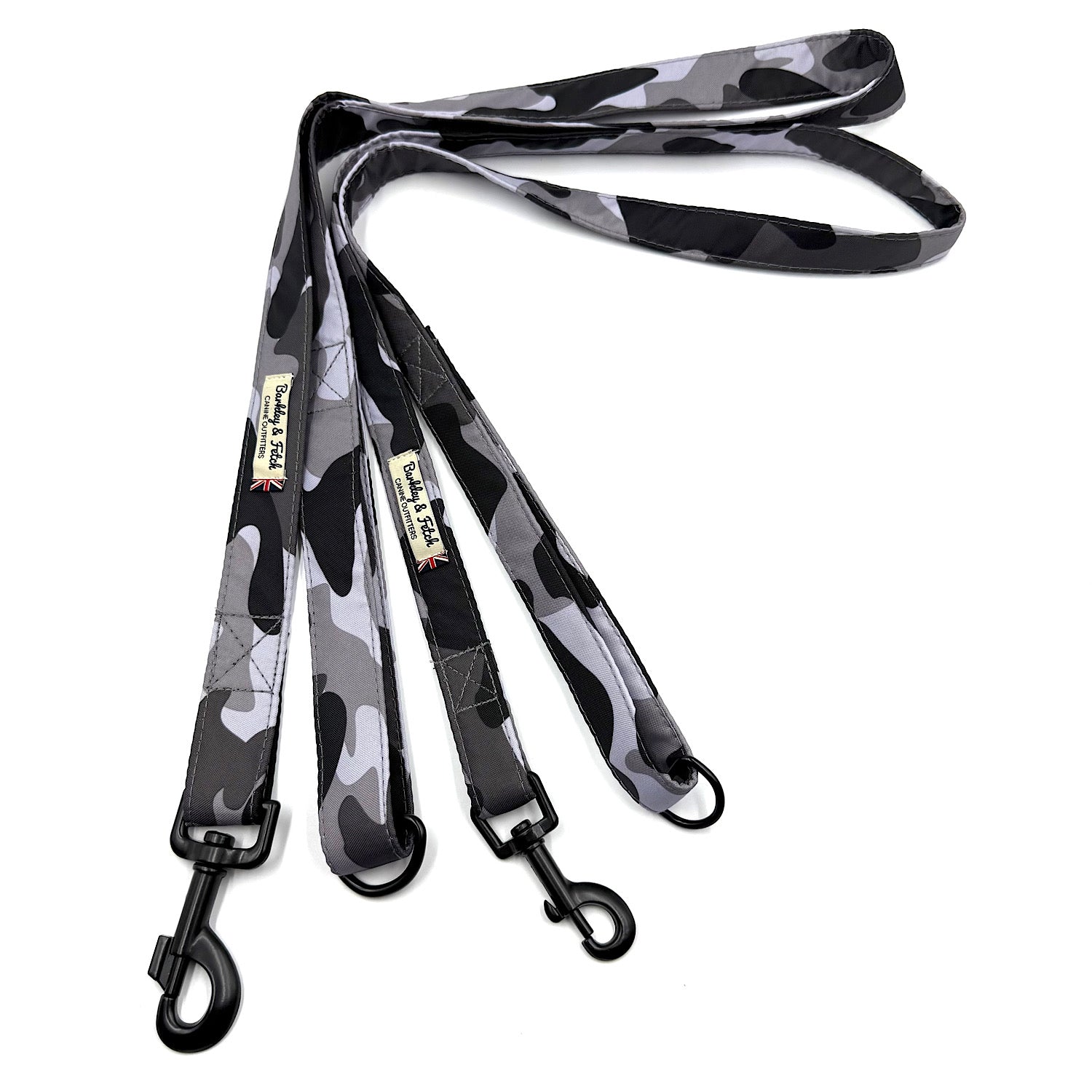 Camouflage-patterned dog leash with black clip on a white background