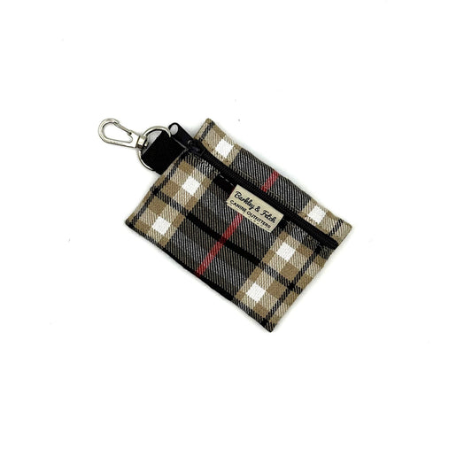 Plaid patterned keychain pouch with a visible brand label on a white background