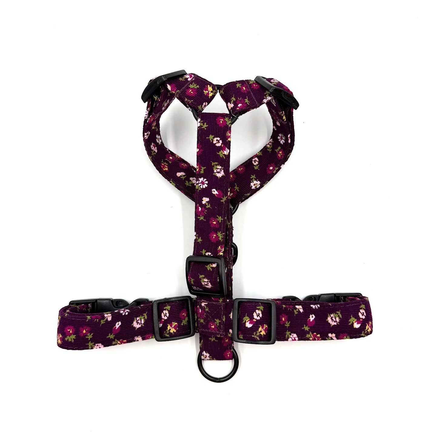Floral-patterned dog harness on a white background