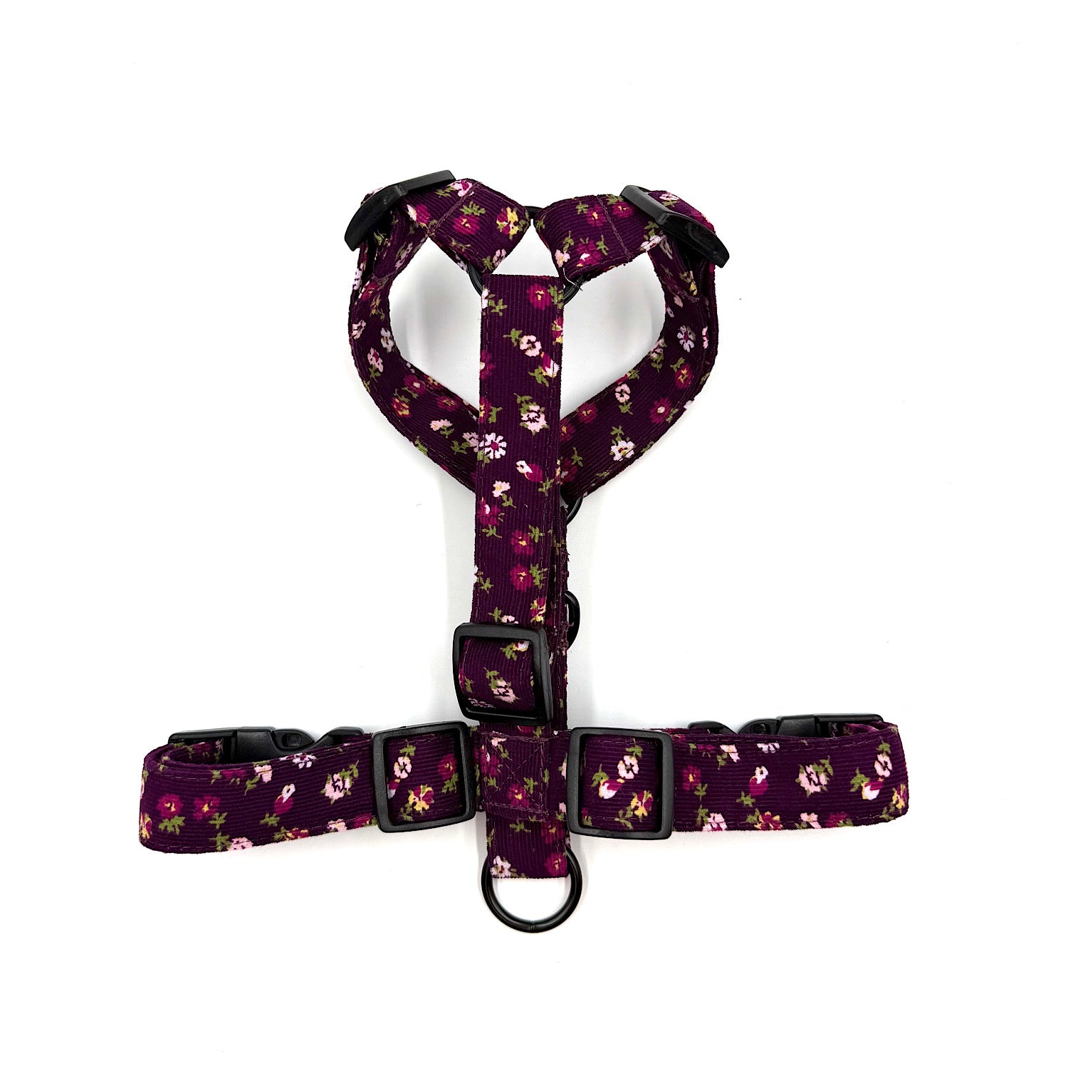 Floral-patterned dog harness on a white background