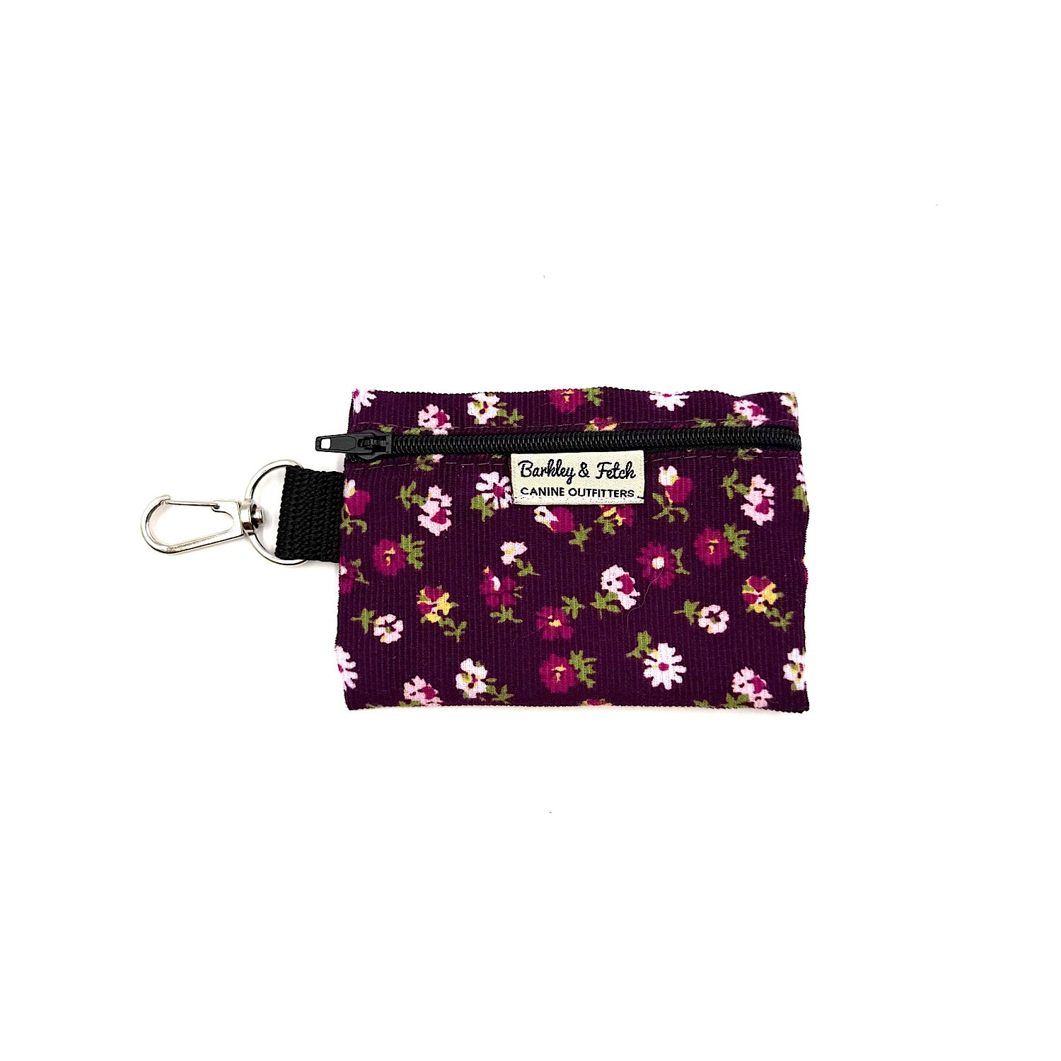 Floral patterned pouch with a keyring on a white background