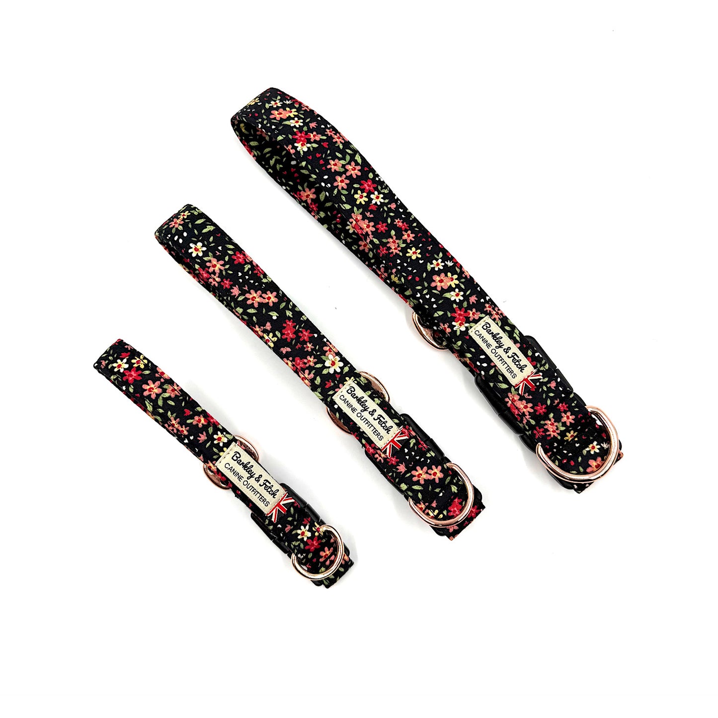 Set of floral-patterned dog collars and leashes on a white background
