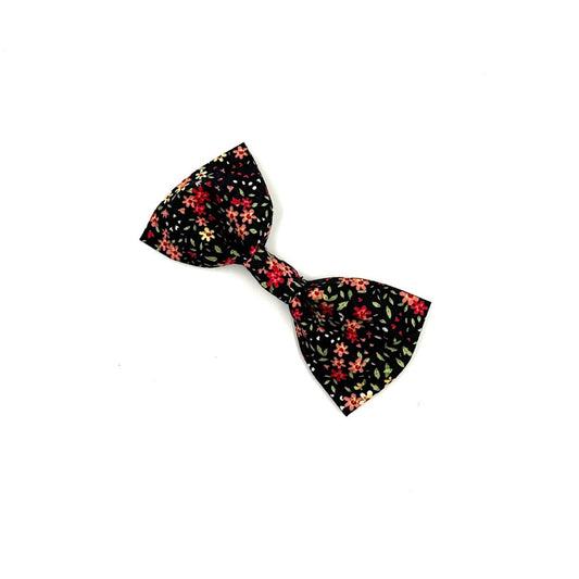 Floral-patterned bow tie on a white background