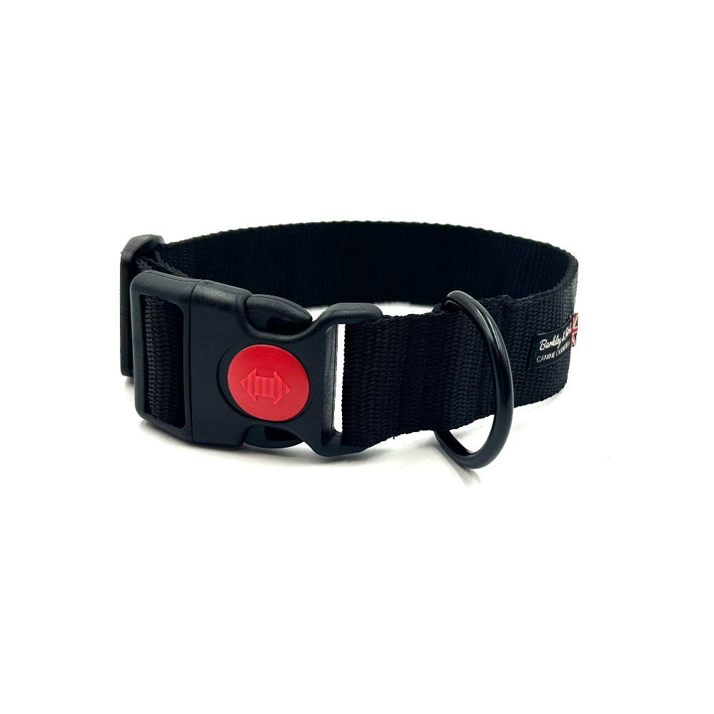 Black dog collar with a red button on a white background. Handmade in the UK by Barkley and Fetch