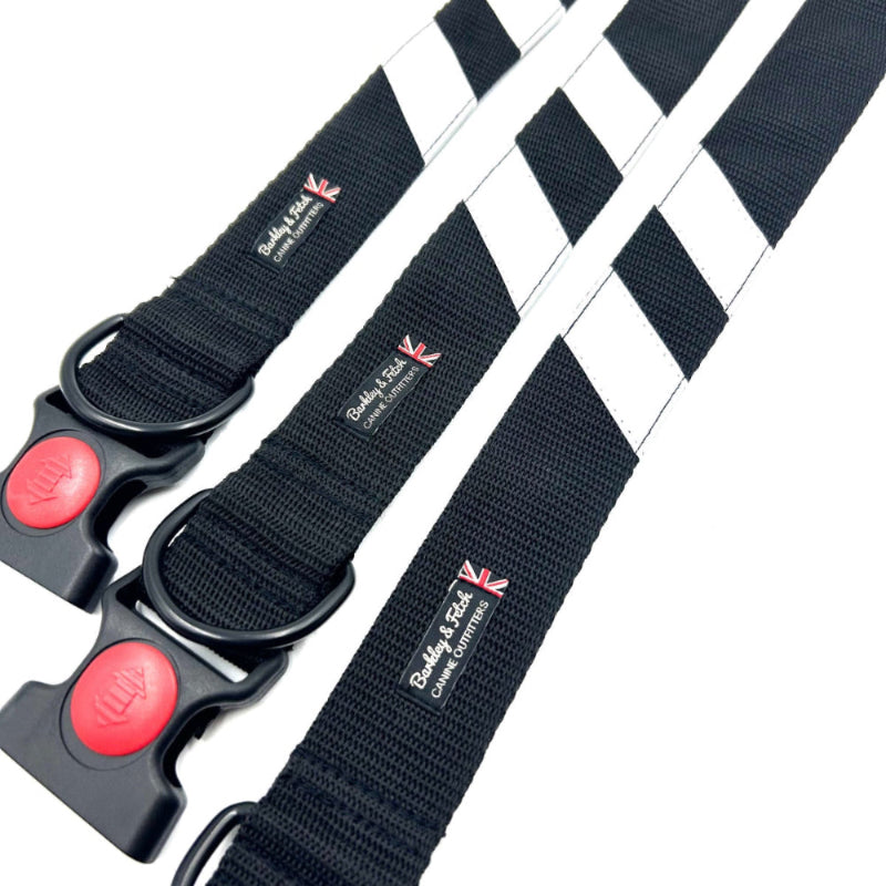 Black dog collarss with red buttons and visible brand logo on a white background Handmade in the UK by Barkley and Fetch