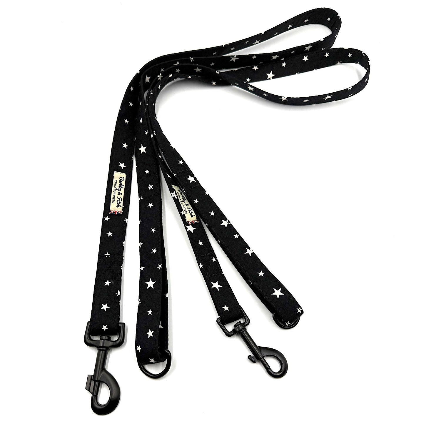 Black dog leash with white star pattern on a white background