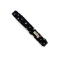 Black dog collar with white star pattern on a white background